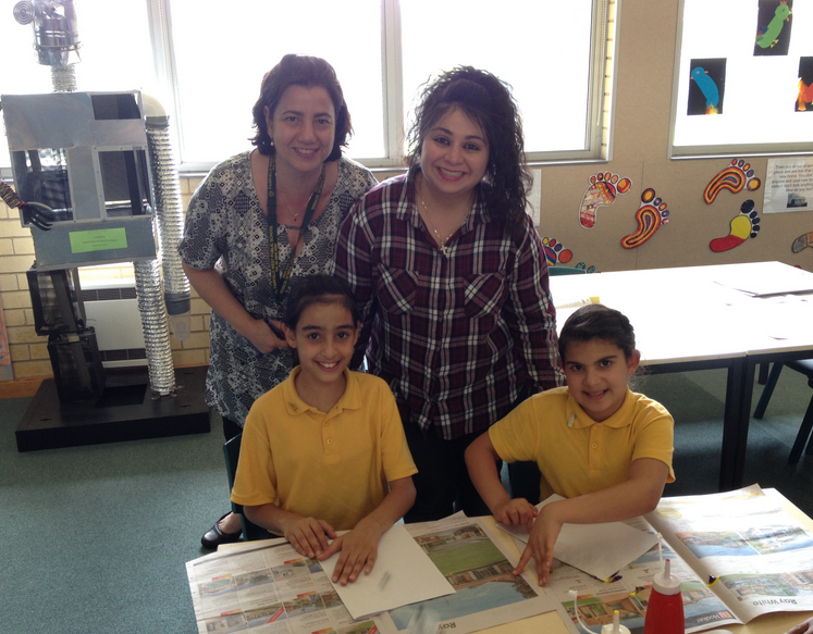 Two teachers and Arabic students reading
